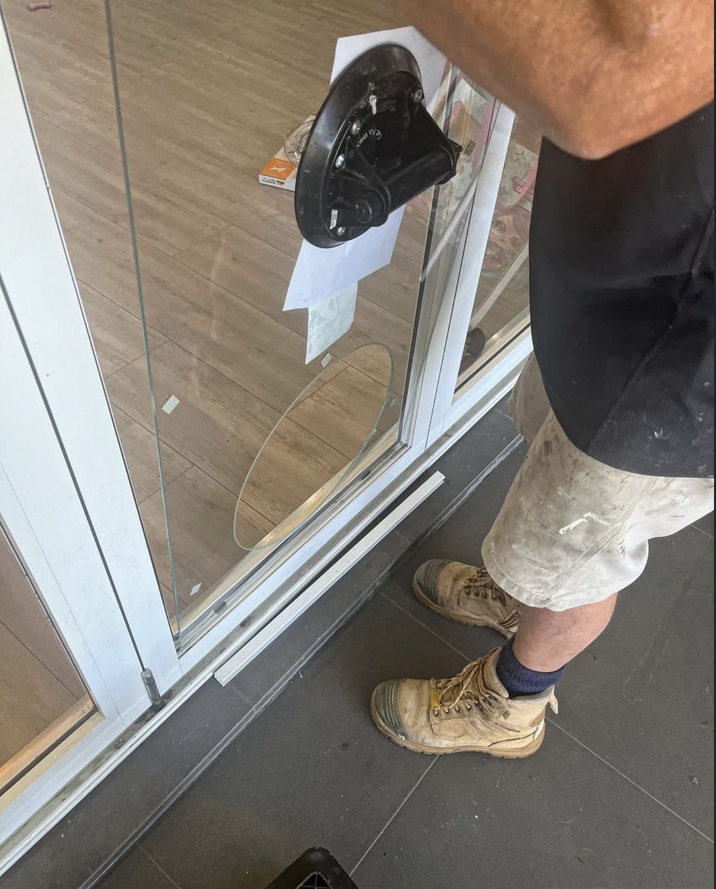 Dog Door Australia installing a medium sized dog door into a glass bi-fold door in Adelaide