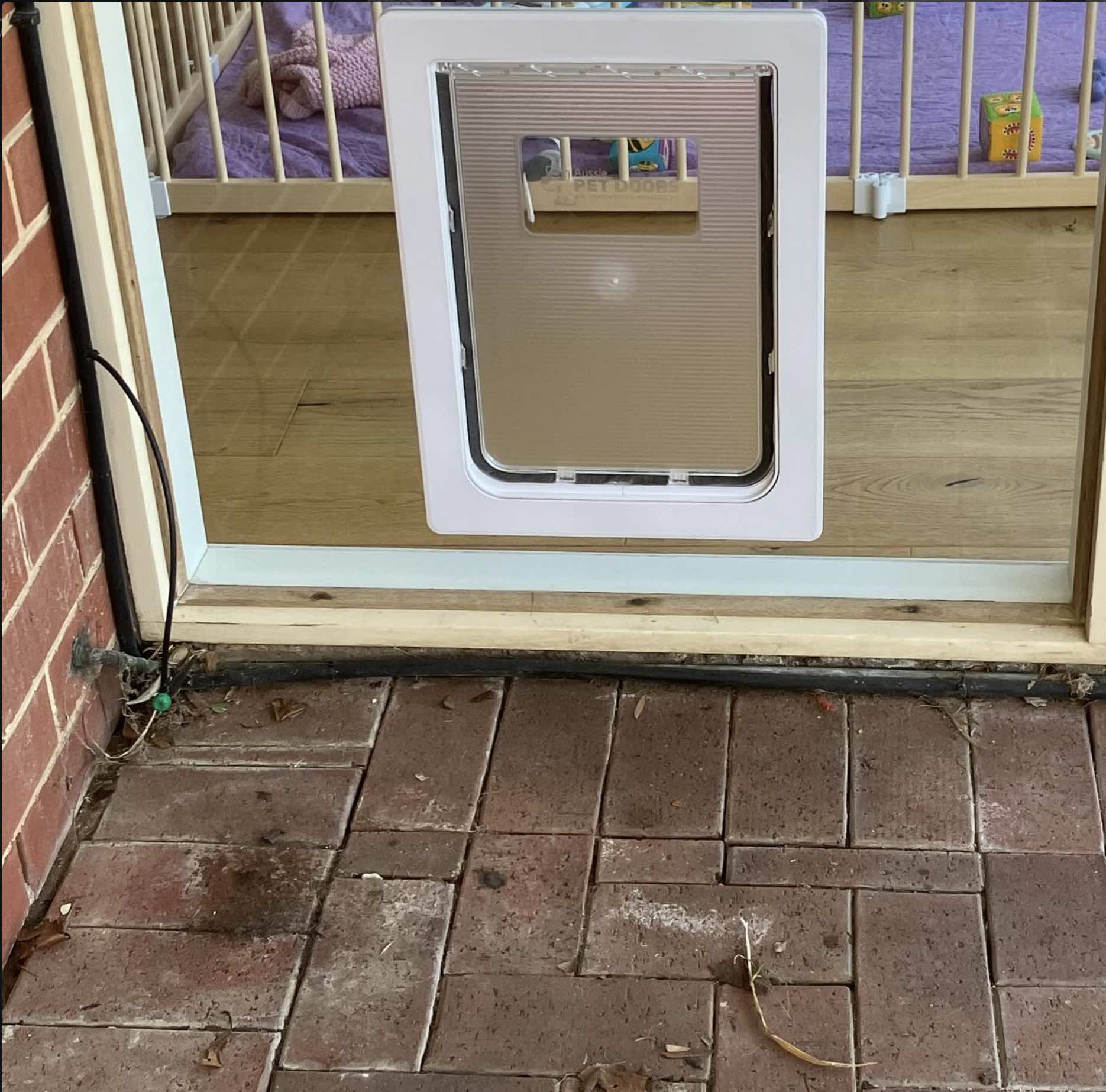 Large Dog Door installed into a window in Adelaide by Dog Door Australia